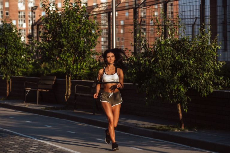 a woman running on a street