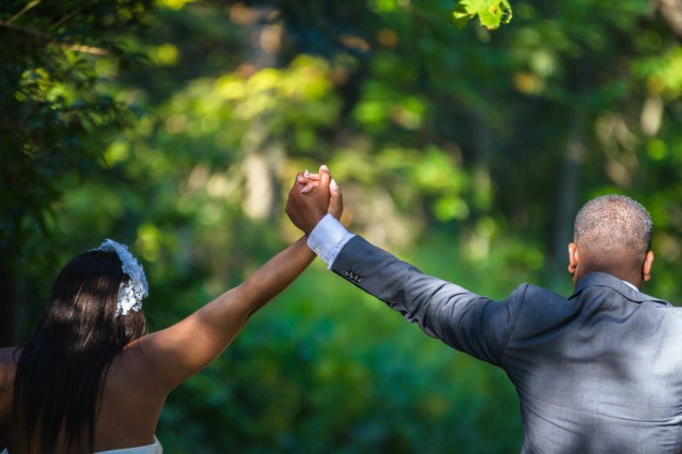 a man and woman pointing at each other