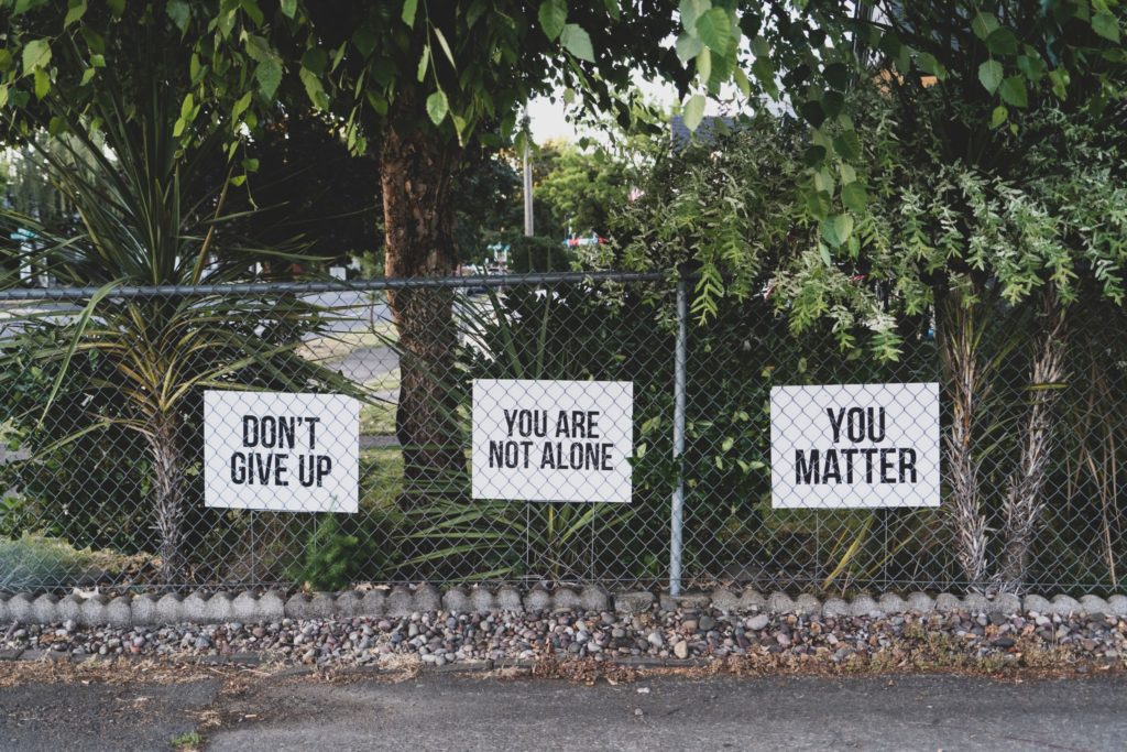a fence with signs on it