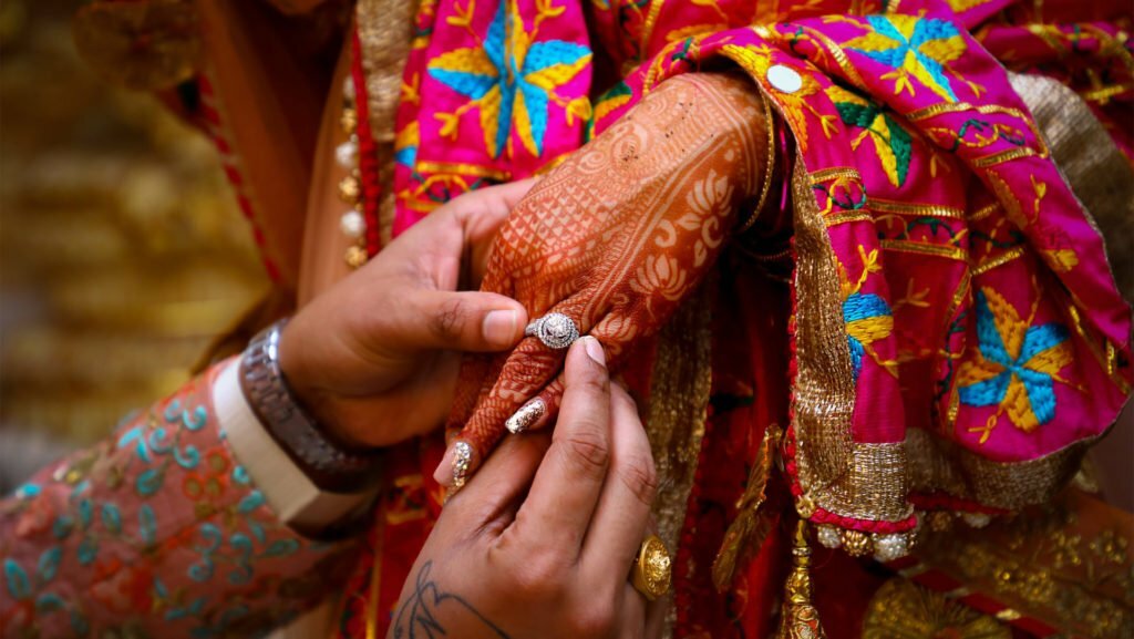 a person holding a necklace